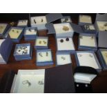 A quantity of silver earrings in original retail boxes approx 25 pairs