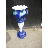 A blue jardinere stand and bowl