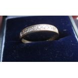 A 9ct gold and diamond half eternity ring