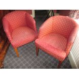 A pair of upholstered tub chairs