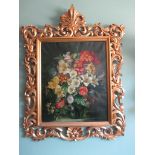 A florentine floral oil on canvas in a gilt wood frame