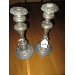 A pair of 19th century pewter candlesticks