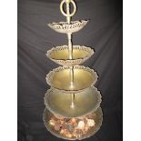 A five tier plated brass dumb waiter