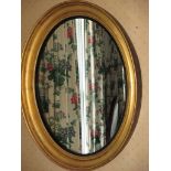 A Victorian gilt framed oval wall mirror