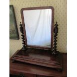 An early 19th Century toilet mirror with turned pillars