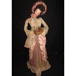 A large vintage, American composition doll in period costume