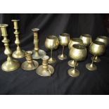 A set brass goblets and candle sticks