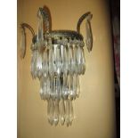 A pair of brass and lead crystal bracket wall lights