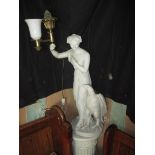 A large figural lamp of a goddess with a bird of prey on a contemporary column stand. Marked to rear