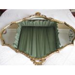 A modern gilt framed mirror with shell finial