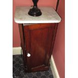 An Edwardian mahogany marble topped pot cupboard