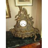 An early 20th century spelter mantle clock with a Scottish huntsman