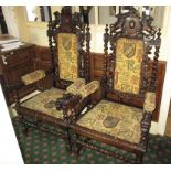A pair of gothic style upholstered arm chairs