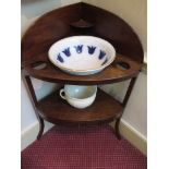 A Georgian mahogany corner wash stand with bowl