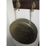 A wall mounted brass gong