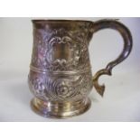 A Henry Brind 1784 Heavily Embossed Georgian Silver Tankard Inscribed To Rim "To Sergeant Lay From