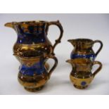 Four Copper Lustre Jugs