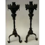 A Pair Of Gothic Style Candlestick Holders