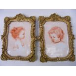 A Pair Of Gilt Framed Porcelain Plaques Signed MC