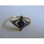 A Yellow Metal Ring With Platinum Set Diamonds & Sapphire