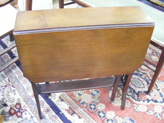 An Edwardian Mahogany Sutherland Table