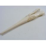 A Pair Of Antique Ivory Tongs With Craved Decor