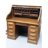 An Edwardian Oak Roll Top Desk