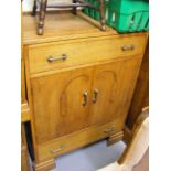 An Oak Cupboard With Drawers