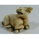 A Japanese Carved Ivory Netsuke