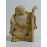 A Japanese Carved Ivory Netsuke