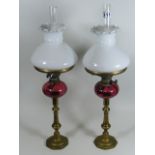 A Pair Of C.1900 French Style Oil Lamps With Cranberry Bowls