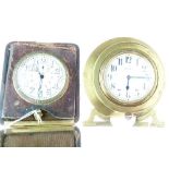 Early 20th Century brass cased travel clock having white enamel dial and Arabic numerals, having