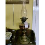 Late 19th/early 20th Century oil lamp having facet cut clear glass reservoir on a gilt metal