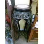 Early 20th Century Chinese hardwood plantstand having inset marble top and carved frieze, raised