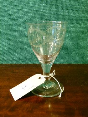 Large 19th Century wine glass with engraved bell husk and swag decoration