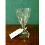 Large 19th Century wine glass with engraved bell husk and swag decoration