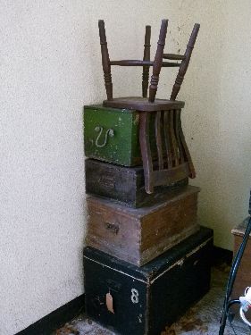 Three pine boxes having hinged covers together with a vintage trunk