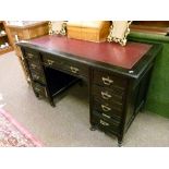 Late Victorian Aesthetic School ebonised double pedestal kneehole desk having an inset tooled