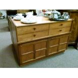 1980's period teak sideboard fitted four short drawers over two panelled doors
