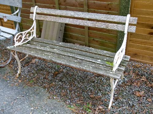 Early 20th Century slatted garden bench having wrought iron ends