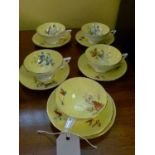 Minton's part tea set having hand painted decoration of flowers against a yellow ground, the base
