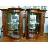 Pair of late 19th/early 20th Century walnut cased serpentine front table top display cabinets,