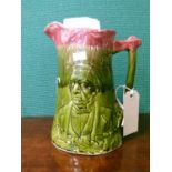 Late 19th Century Staffordshire Majolica green and pink glazed jug decorated in relief with a