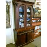 Victorian mahogany two section bookcase, the upper section fitted two glazed doors, the base with