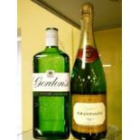 Wines and spirits - Gordon's Gin, 1 x 70cl bottle together with a bottle of Waitrose Champagne