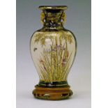 Satsuma earthenware baluster vase decorated with Wisteria, Iris and Bamboo within two reserve panels