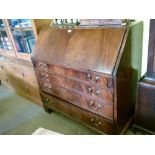 George III mahogany bureau, the fall flap revealing a shaped mahogany and string inlaid interior