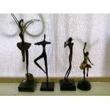 Four various modern bronze figures, each depicting a dancer or musician
