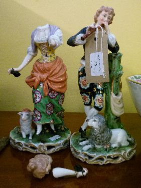 Pair of early 20th Century Continental porcelain figures depicting a lady and gentleman playing