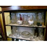 Quantity of good quality cut glass decanters etc (two shelves)